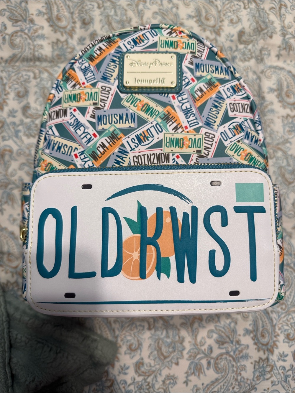 Loungefly Kids Mini Backpack with White, Teal, Orange License Plate Design